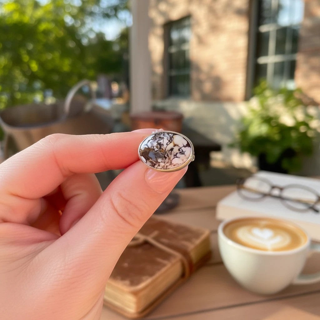 Wildflower Artisans sterling silver ring featuring a natural Wild Horse stone with cream and rust patterns.
