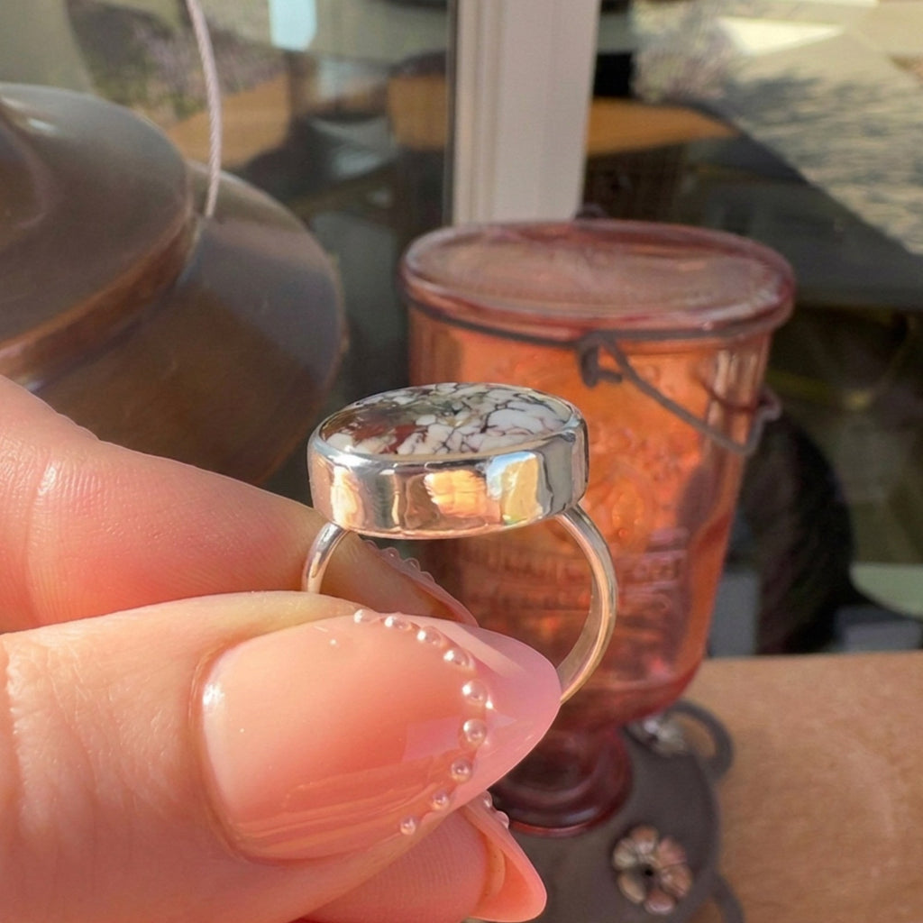 Wildflower Artisans sterling silver ring featuring a natural Wild Horse stone with rust and cream patterned cabochon.