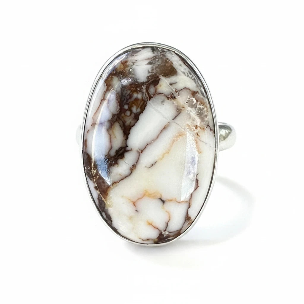 Wildflower Artisans sterling silver ring featuring an oval Wild Horse magnesite cabochon with cream and brown patterns.