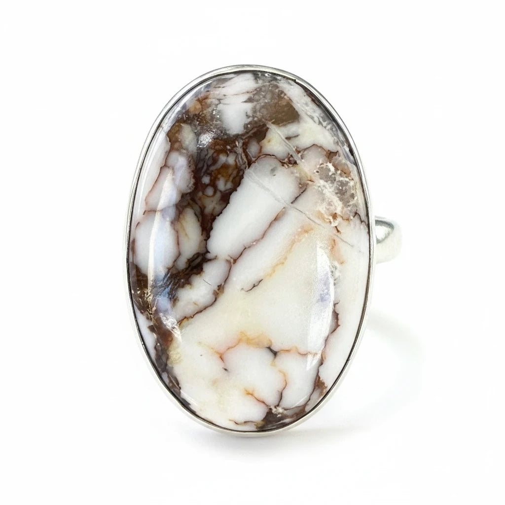 Wildflower Artisans sterling silver ring featuring an oval Wild Horse magnesite cabochon with cream and brown patterns.