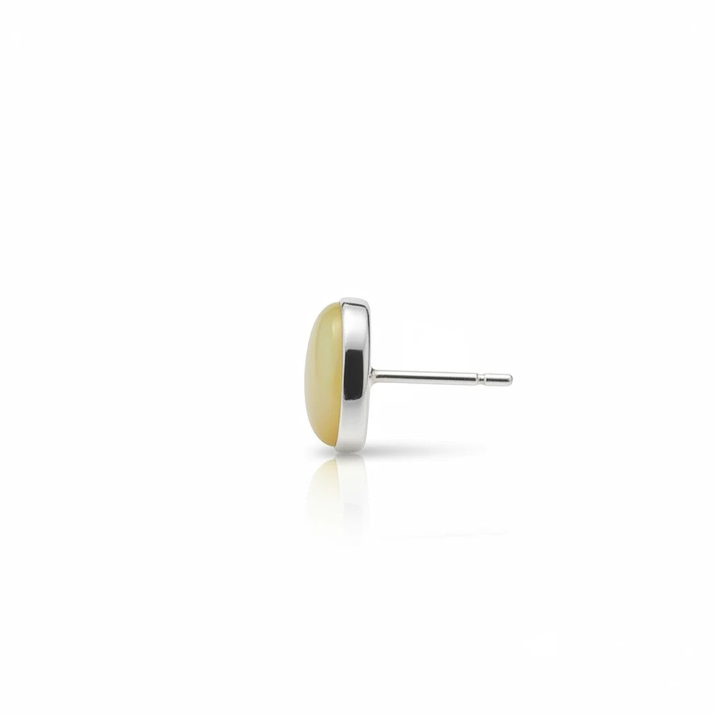 Wildflower Artisans yellow opal stud earring in a 14K gold setting, side profile view showing the smooth oval stone.