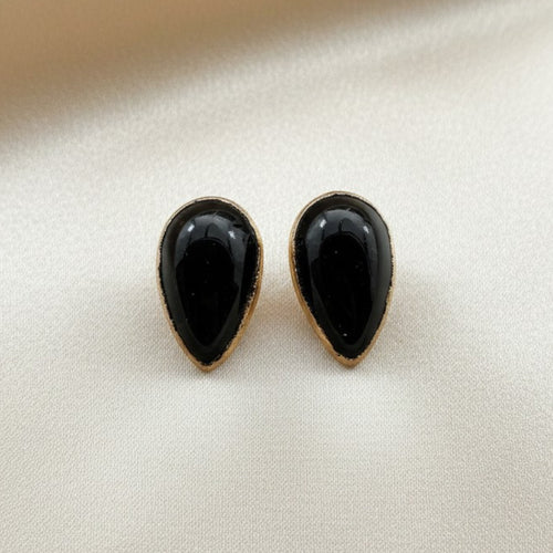 Wildflower black onyx teardrop stud earrings in 24K gold bezel. Pear-shaped polished onyx.