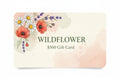Wildflower $500 gift card with a watercolor floral design featuring poppies, daisies, and lavender.