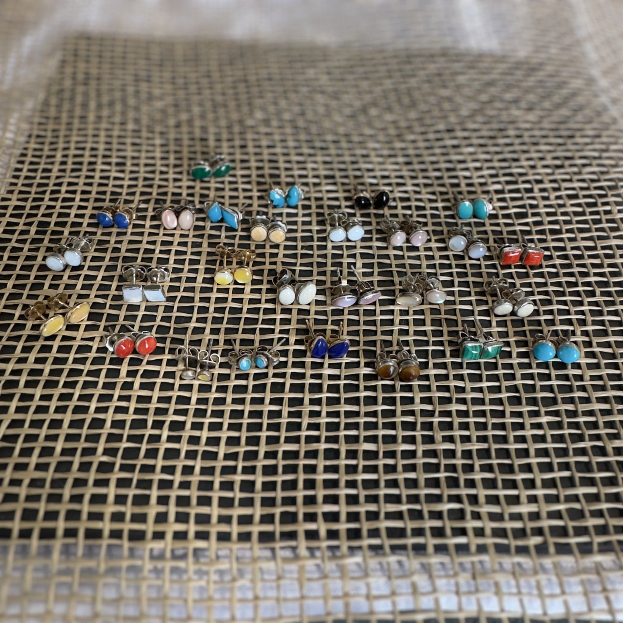 The Wildflower stud earring collection in assorted natural stones, shown together