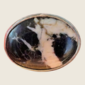 White buffalo stone ring in sterling silver, size 6.5, shown on a bone linen background